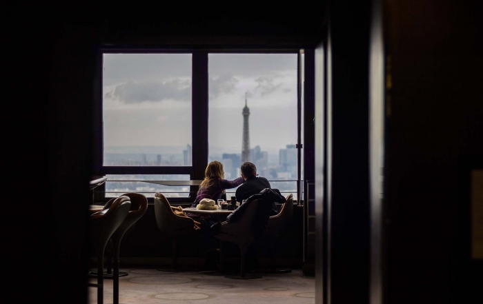 Stephanie Sarkis - Pyschology Today article image of a woman &man at a cafe overlooking a city looking out the window. Photo Credit: Photo by Alban Martel on Unsplash