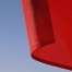 Image of bottom corner of a red flag against a blue sky. Newsweek Red Flags for Toxic Relationships - Stephanie Sarkis - article -cristi-goia-cn6WRiJDA4E-unsplash.jpg